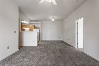 living room and kitchen with white walls and carpet at Polo Run Apartments, Indiana, 46142
